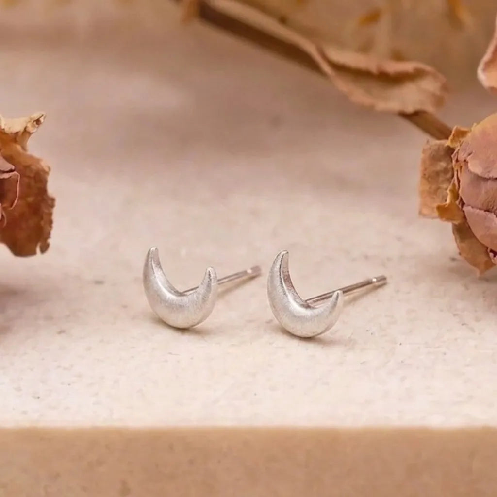 Marvel Silver crescent moon stud earrings for women and girls featuring a minimalist silver-plated celestial moon design with a polished finish and secure stud backing.