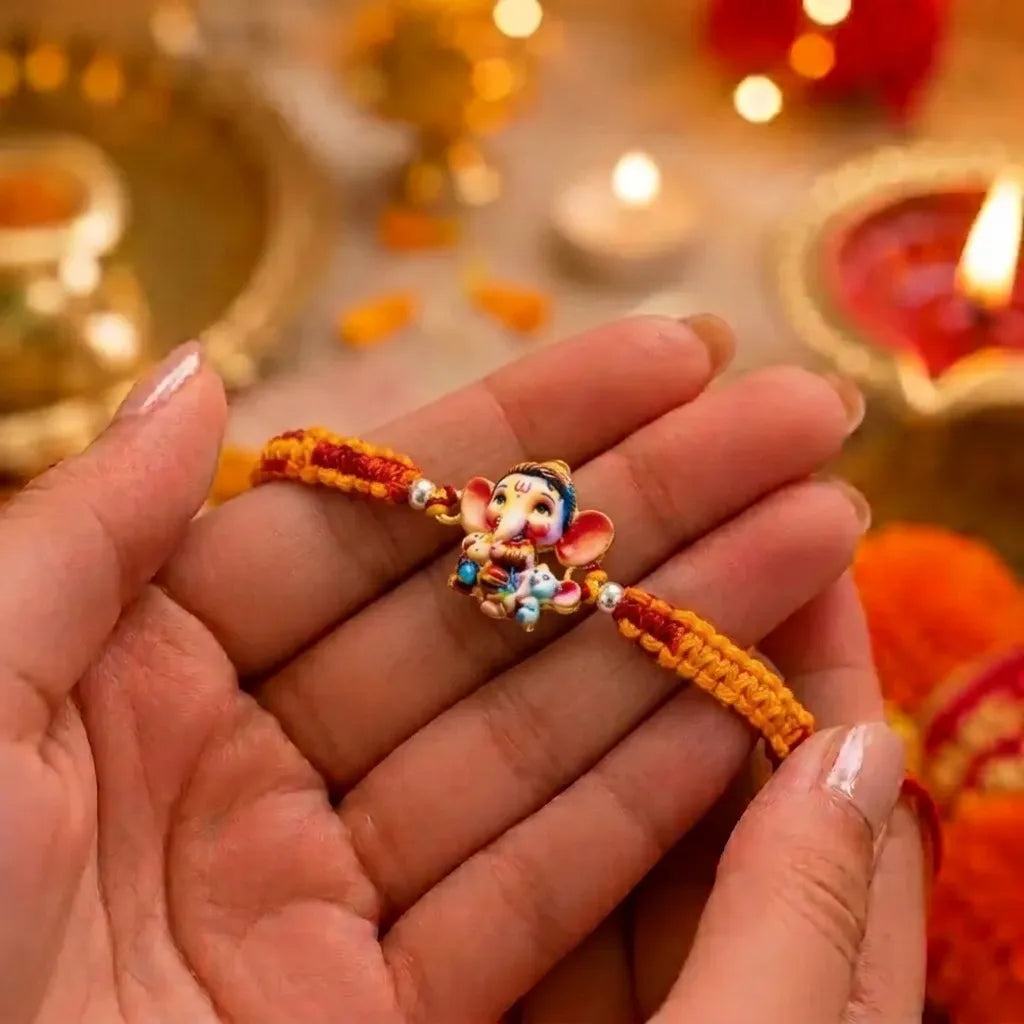Cute Bal Ganesh Kids Rakhi with Handmade Orange & Red Thread for Raksha Bandhan
