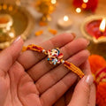 Cute Bal Ganesh Kids Rakhi with Handmade Orange & Red Thread for Raksha Bandhan