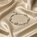 Marvel Silver Elegant Pearl Double-Layer Silver Bracelet for women with white pearl-style beads and delicate layered silver chains