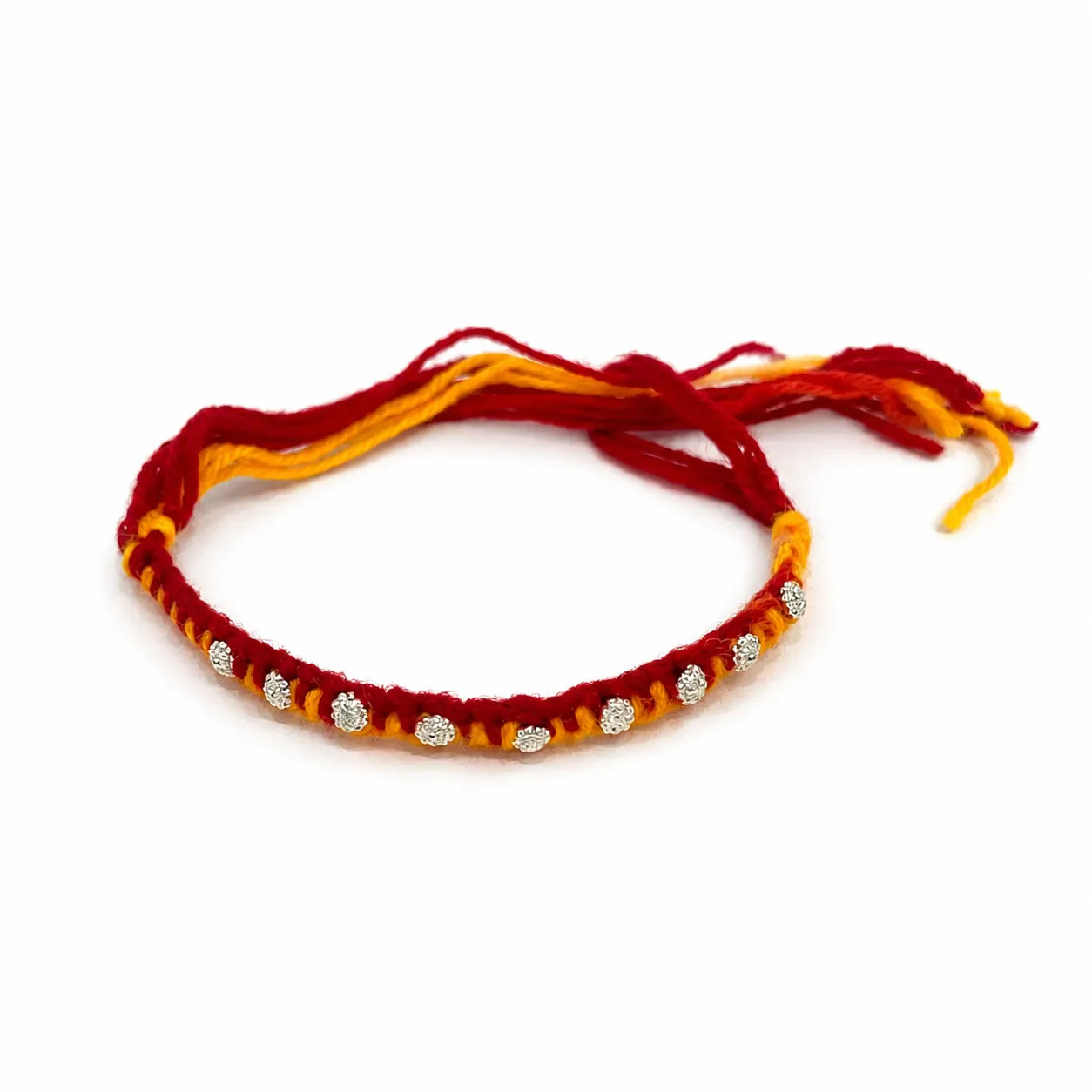 Marvel Silver floral motif yellow red rakhi with multiple silver-tone decorative charms