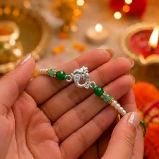 Ganesha Silver Rakhi with Green Beads