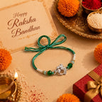 Marvel Silver Ganesha Silver Rakhi with Green Crystal Beads and White Pearl Beads for Raksha Bandhan