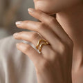 Marvel Silver gold-plated abstract adjustable ring for women and girls featuring a modern wave-inspired open design with a premium polished finish.