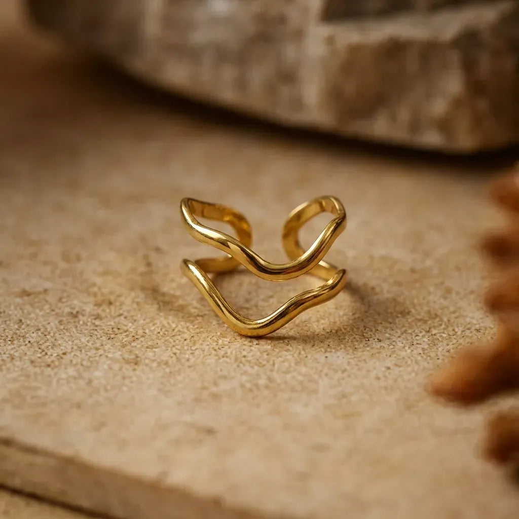 Marvel Silver gold-plated abstract adjustable ring for women and girls featuring a modern wave-inspired open design with a premium polished finish.