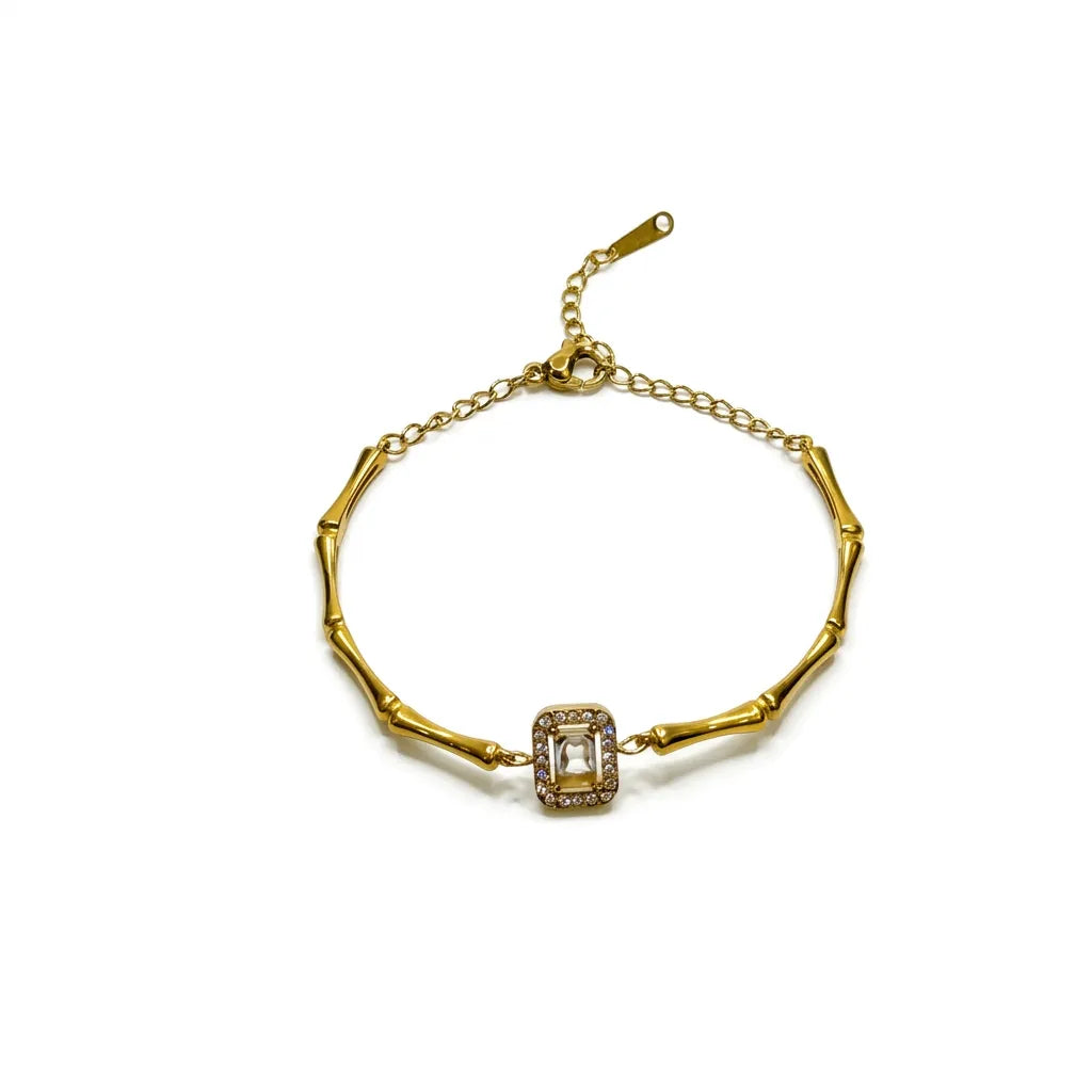 Marvel Silver gold-plated bamboo link bracelet with an emerald-cut crystal centerpiece and adjustable chain for women and girls, featuring a premium polished finish suitable for daily wear, parties, weddings, and festive occasions.