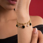 Marvel Silver gold-plated bracelet featuring black enamel round charms, sparkling crystal accents, a stylish link chain, and an adjustable extension chain for women and girls, perfect for everyday wear, parties, weddings, festive occasions, and gifting.
