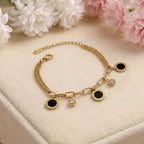 Marvel Silver gold-plated bracelet featuring black enamel round charms, sparkling crystal accents, a stylish link chain, and an adjustable extension chain for women and girls, perfect for everyday wear, parties, weddings, festive occasions, and gifting.