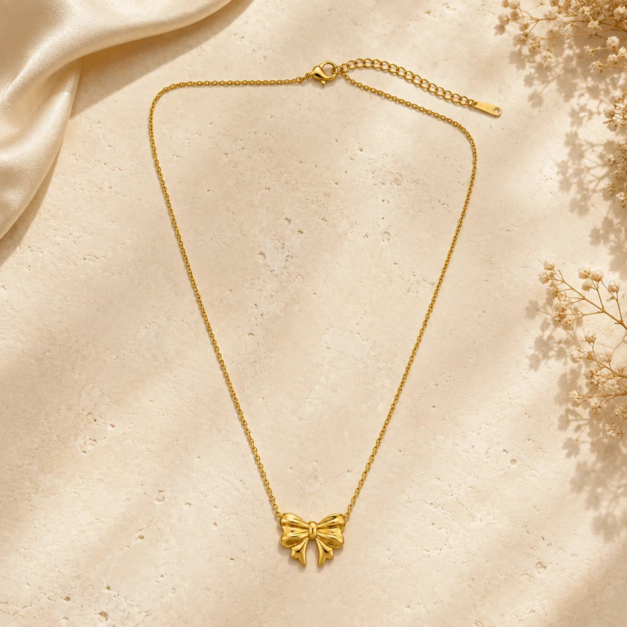 Marvel Silver gold-plated bow chain pendant for women and girls featuring an elegant ribbon bow design with a delicate gold chain and premium polished finish.