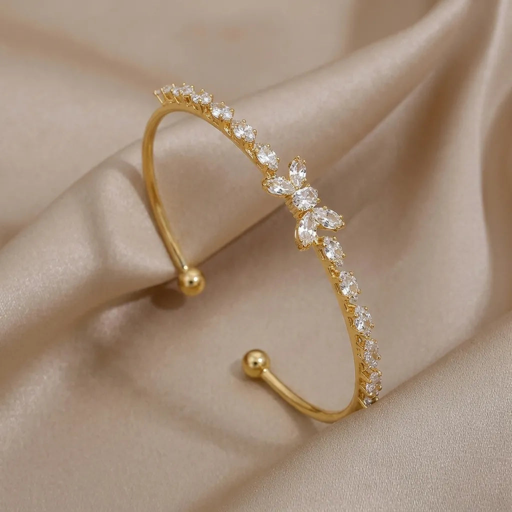 Marvel Silver gold-plated open cuff kada featuring sparkling marquise-cut cubic zirconia stones with an elegant floral centerpiece, designed for women and girls, perfect for weddings, parties, festive occasions, daily wear, and gifting.