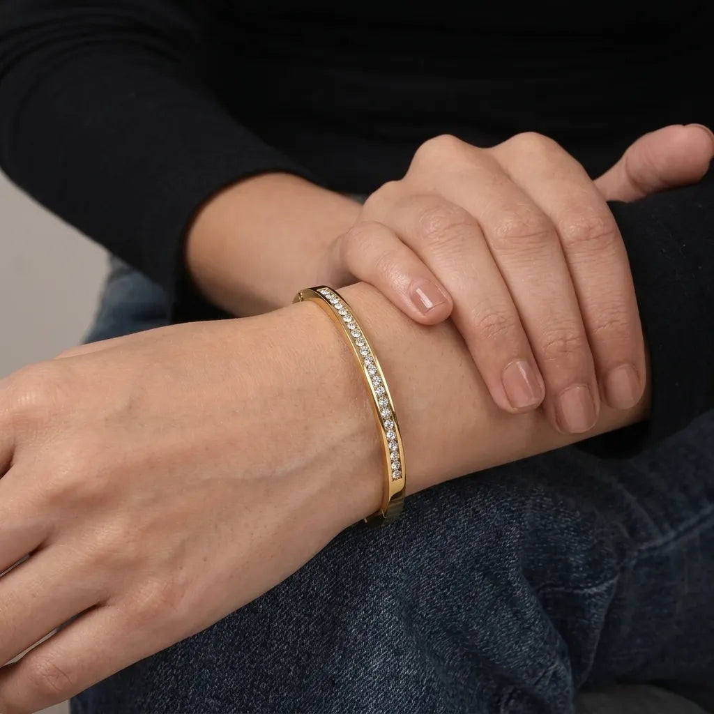 Marvel Silver gold-plated slim crystal kada bracelet for women and girls featuring a sleek minimalist design with sparkling crystal stone detailing and a secure hinged closure, ideal for daily wear, office, parties, weddings, festive occasions, and gifting.