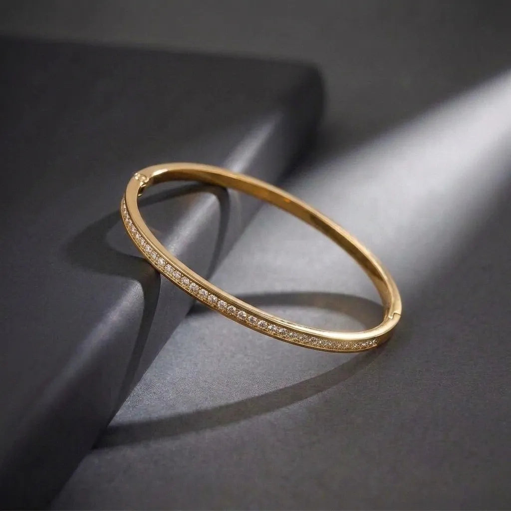 Marvel Silver gold-plated slim crystal kada bracelet for women and girls featuring a sleek minimalist design with sparkling crystal stone detailing and a secure hinged closure, ideal for daily wear, office, parties, weddings, festive occasions, and gifting.
