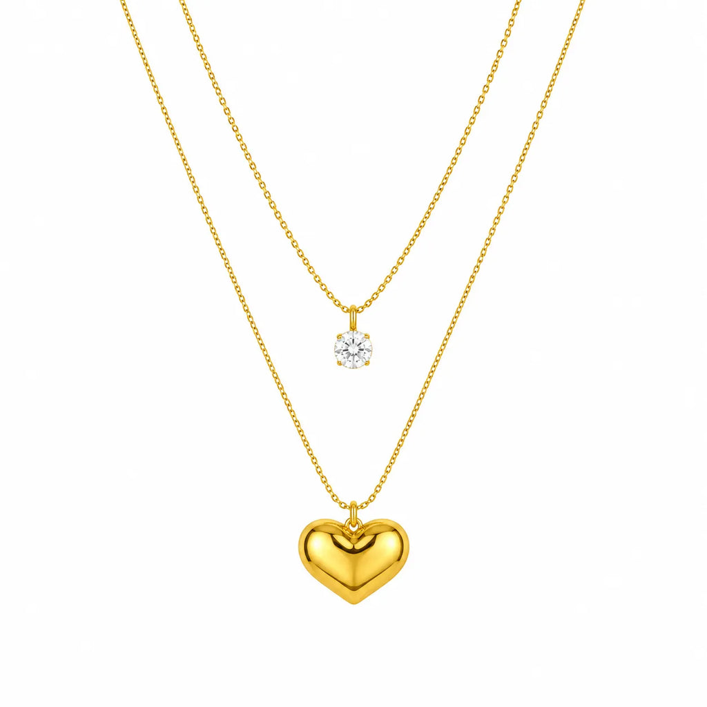 Marvel Silver gold-plated double layer heart chain pendant for women and girls featuring a sparkling solitaire crystal on the upper chain and a polished heart pendant with a premium gold finish.
