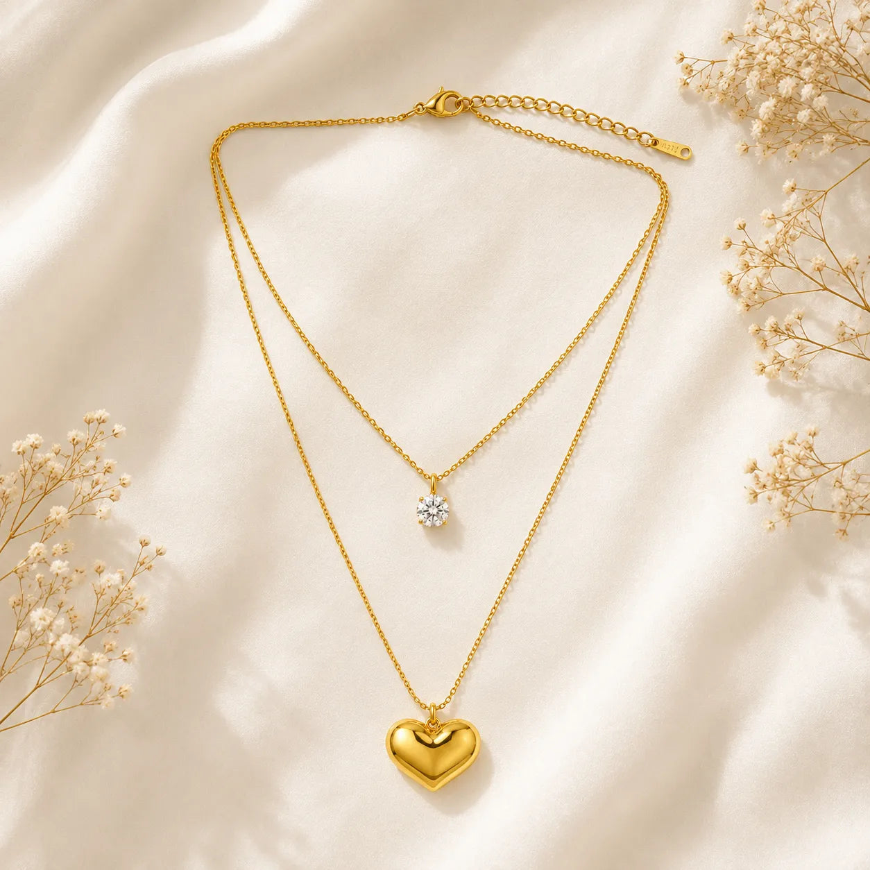 Marvel Silver gold-plated double layer heart chain pendant for women and girls featuring a sparkling solitaire crystal on the upper chain and a polished heart pendant with a premium gold finish.