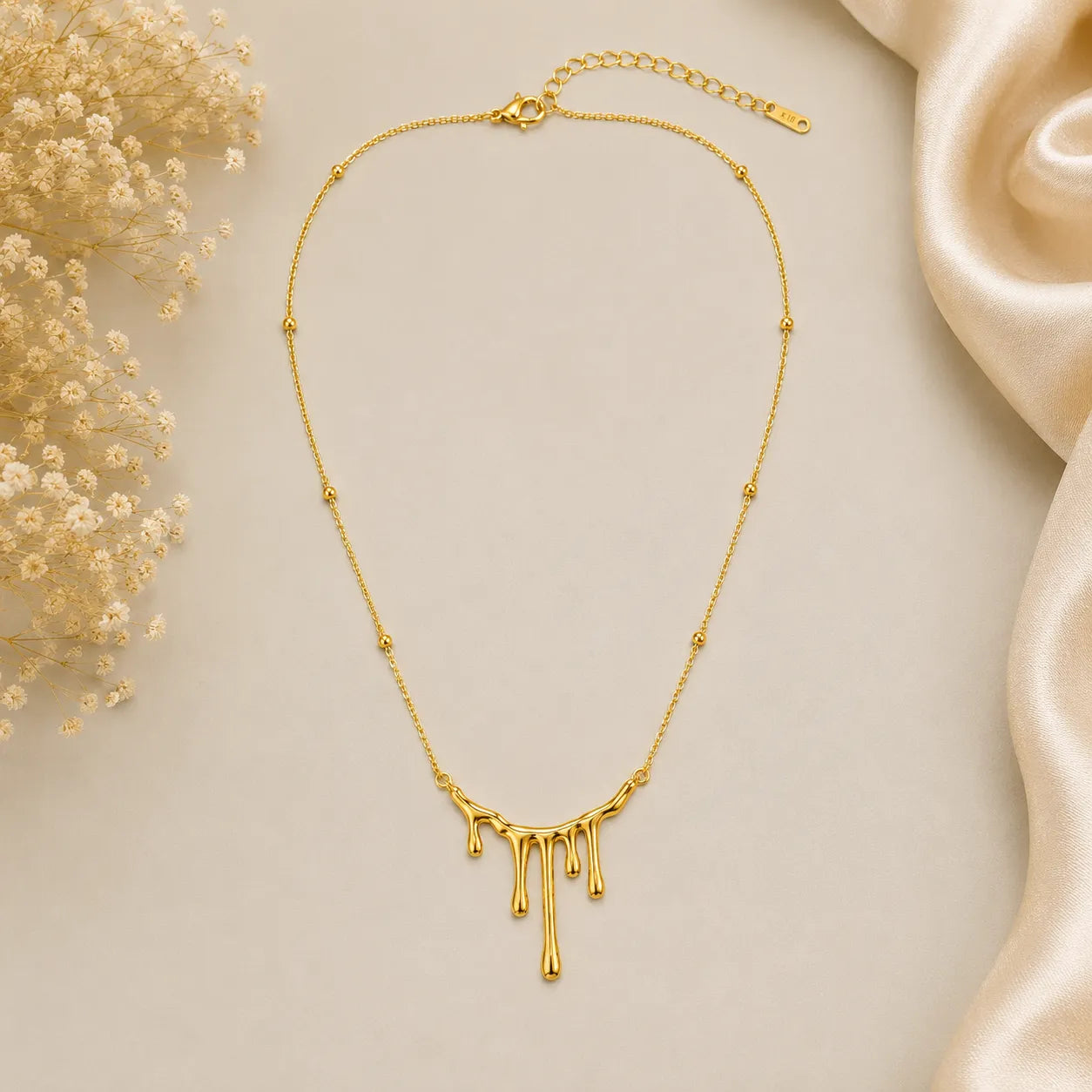 Marvel Silver gold-plated drip design chain pendant for women and girls featuring a modern molten gold pendant on an elegant beaded chain with a polished high-shine finish.