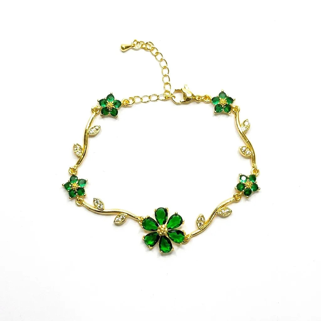 Marvel Silver gold-plated bracelet featuring emerald green floral stones, sparkling crystal leaf accents, vine-inspired detailing, and an adjustable extension chain for women and girls, perfect for daily wear, parties, weddings, festive occasions, and gifting.