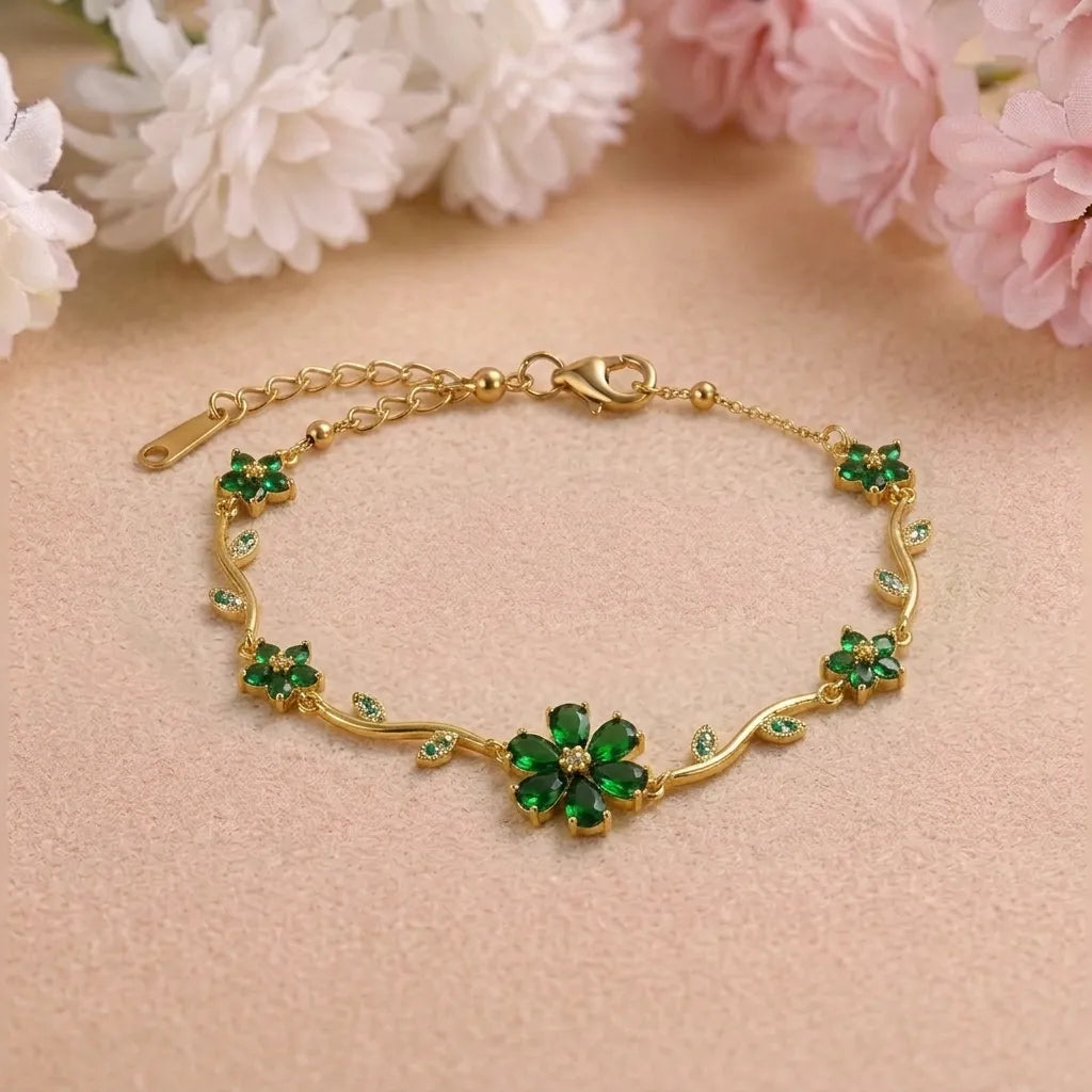 Marvel Silver gold-plated bracelet featuring emerald green floral stones, sparkling crystal leaf accents, vine-inspired detailing, and an adjustable extension chain for women and girls, perfect for daily wear, parties, weddings, festive occasions, and gifting.