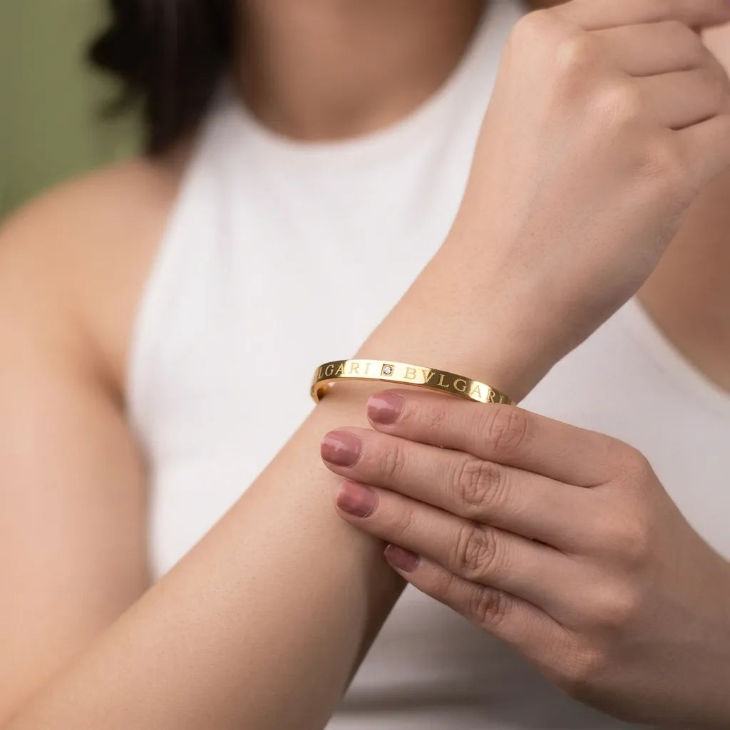 Marvel Silver gold-plated engraved crystal bangle kada featuring a minimalist design with a sparkling center crystal and secure hinged lock, perfect for women and girls for daily wear, office wear, parties, weddings, festive occasions, and gifting.