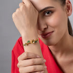Marvel Silver gold-plated floral leaf designer kada featuring elegant flower motifs, green enamel leaves, and a premium twisted wire band with a secure magnetic clasp, perfect for women and girls for weddings, parties, festive occasions, daily wear, and gifting.