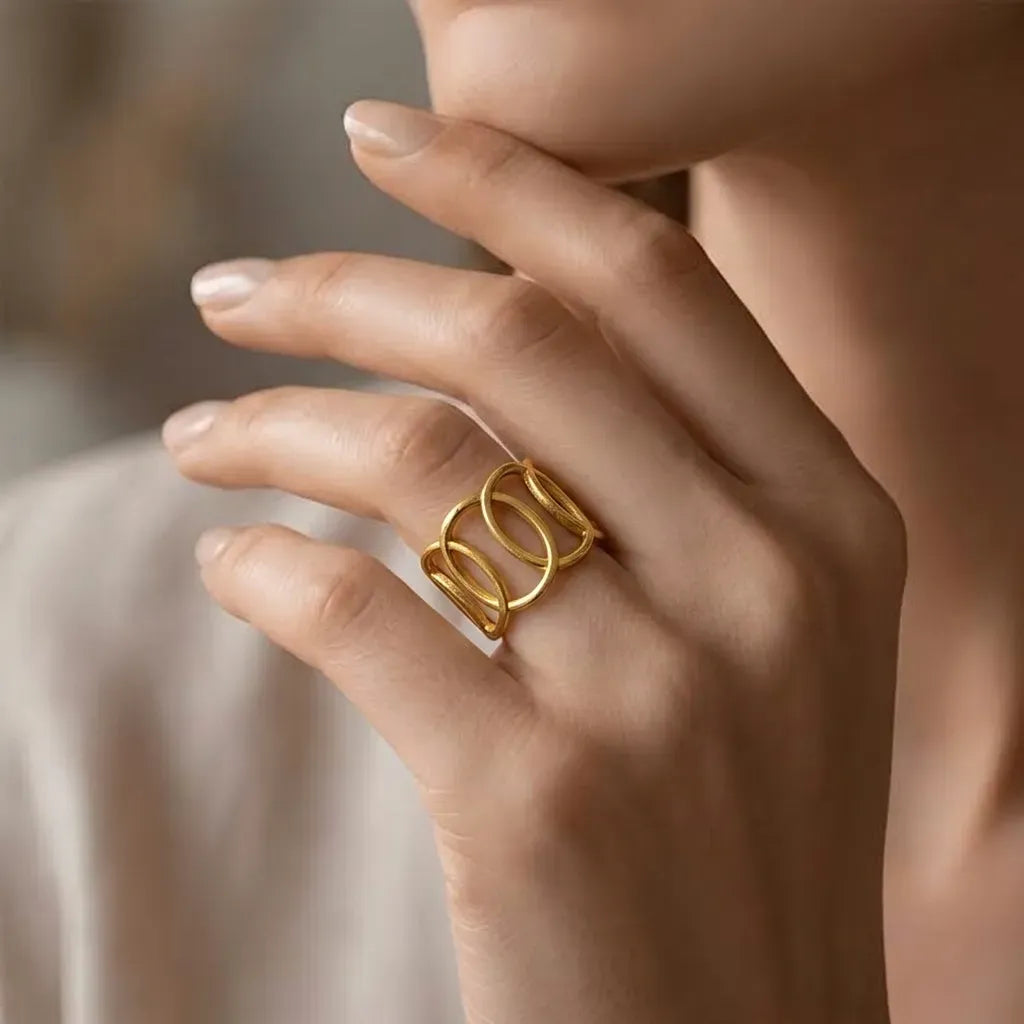 Marvel Silver gold-plated geometric adjustable ring for women and girls featuring an elegant openwork oval design with a polished finish and comfortable adjustable band.