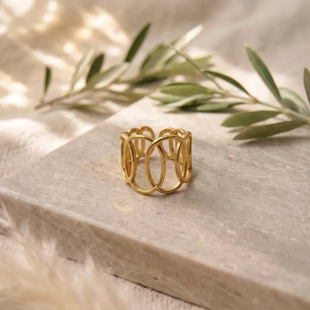 Marvel Silver gold-plated geometric adjustable ring for women and girls featuring an elegant openwork oval design with a polished finish and comfortable adjustable band.