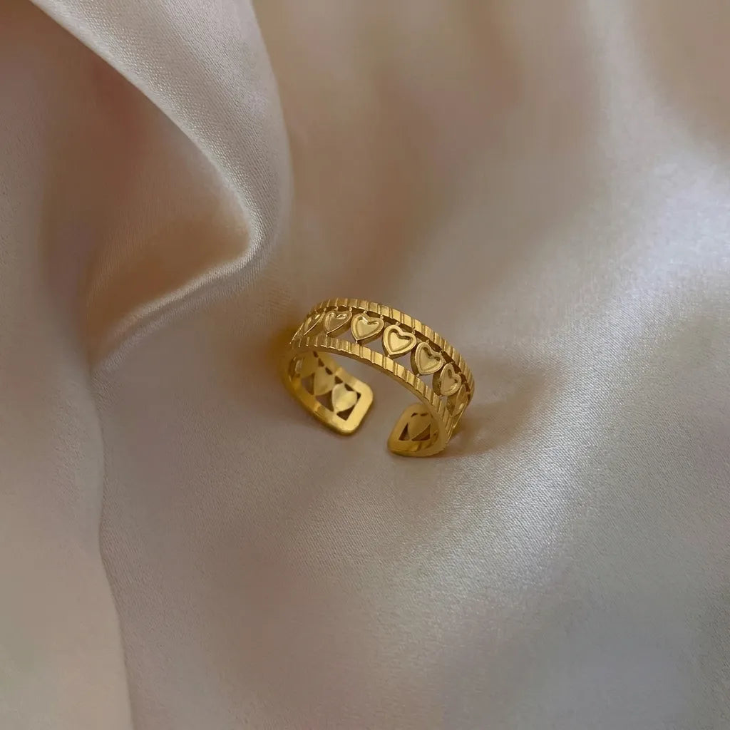 Marvel Silver gold-plated heart adjustable ring for women and girls featuring multiple open-heart motifs, an adjustable open band, and a premium polished gold finish.