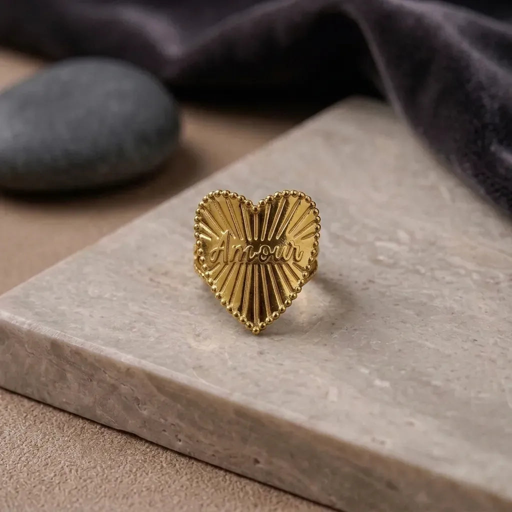 Marvel Silver gold-plated heart-shaped Amour statement ring for women and girls featuring an engraved love design with sunburst detailing and a premium polished finish, perfect for everyday wear and special occasions.