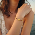 Marvel Silver gold-plated bracelet featuring a floral heart charm centerpiece with elegant gold-tone bar links and an adjustable chain, designed for women and girls for everyday wear, parties, weddings, festive occasions, and gifting.