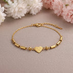 Marvel Silver gold-plated bracelet featuring a floral heart charm centerpiece with elegant gold-tone bar links and an adjustable chain, designed for women and girls for everyday wear, parties, weddings, festive occasions, and gifting.