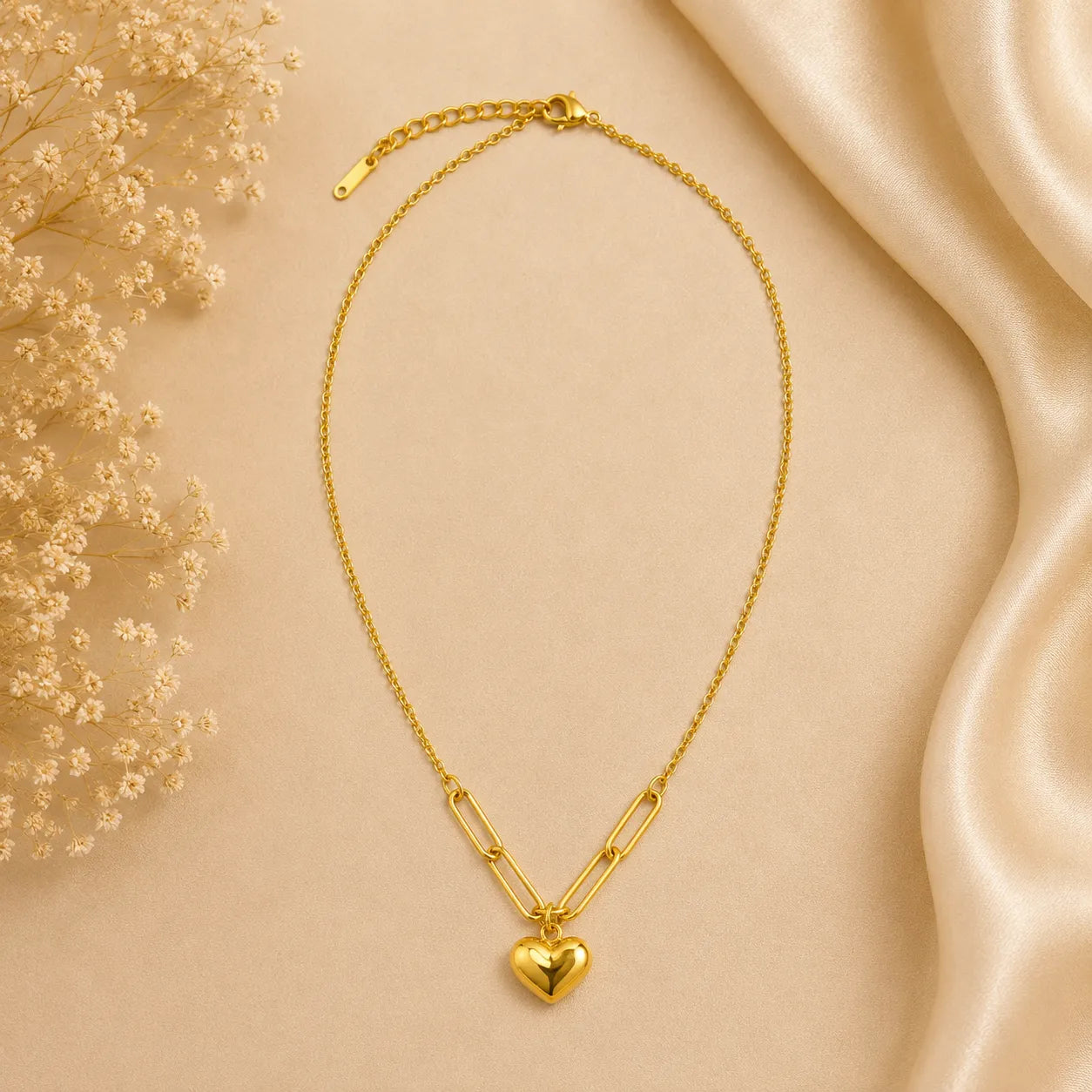 Marvel Silver gold-plated heart charm chain pendant for women and girls featuring a polished puffy heart with stylish paperclip chain accents and a premium minimalist design.