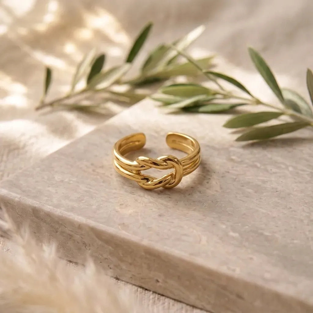 Marvel Silver gold-plated knot adjustable ring for women and girls featuring a modern intertwined knot design with a polished finish and an open adjustable band.