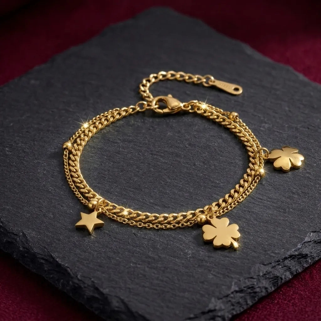 Marvel Silver gold-plated layered bracelet featuring elegant four-leaf clover charms, a star charm, dual-chain design, and an adjustable extension chain, perfect for women and girls for daily wear, parties, festive occasions, and gifting.