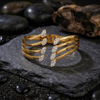 Marvel Silver gold-plated multi-layer cuff kada featuring sparkling marquise-cut Cubic Zirconia stones and a secure hinged closure, designed for women and girls, ideal for weddings, parties, festive occasions, office wear, daily wear, and gifting.