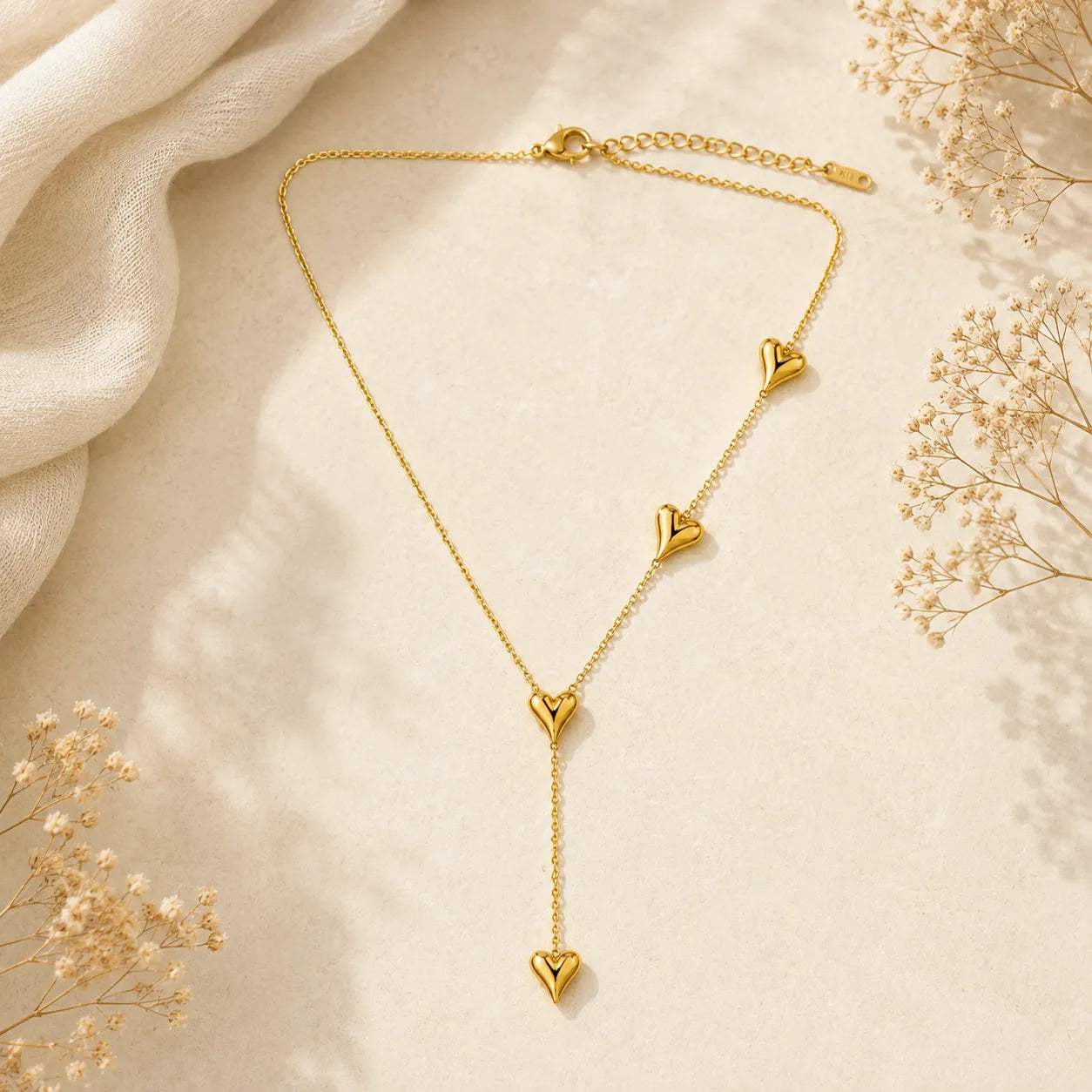 Marvel Silver gold-plated multi heart drop chain pendant for women and girls featuring a Y-shaped chain with polished heart charms and a premium high-shine gold finish, perfect for everyday and party wear.