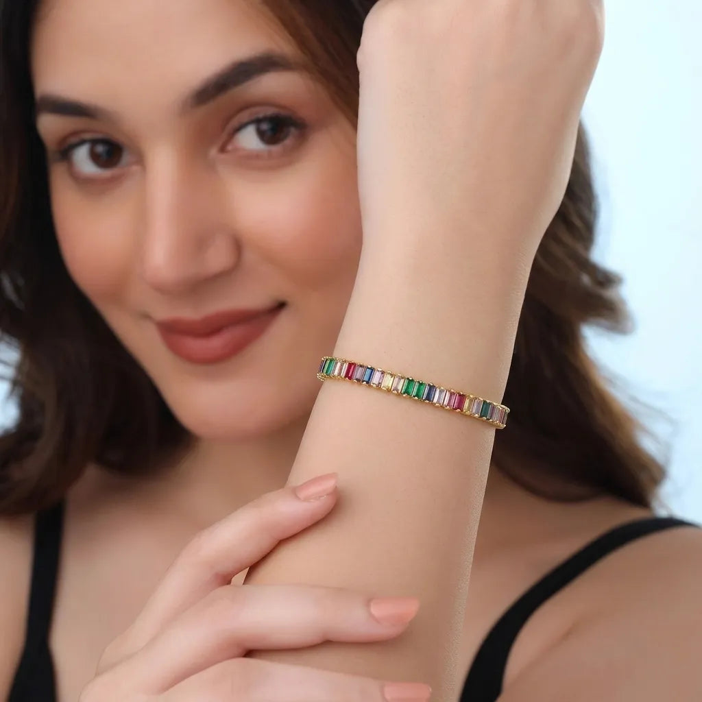 Marvel Silver gold-plated multicolor baguette tennis bracelet for women and girls featuring sparkling colourful CZ stones, a secure box clasp, and a premium polished finish, perfect for everyday wear, parties, weddings, and special occasions.