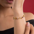 Marvel Silver gold-plated multicolor crystal vine bracelet featuring purple, pink, and white oval and marquise-cut stones with an elegant floral-inspired design for women and girls, ideal for weddings, parties, festive wear, daily styling, and gifting.