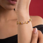 Marvel Silver gold-plated multicolor crystal vine bracelet featuring purple, pink, and white oval and marquise-cut stones with an elegant floral-inspired design for women and girls, ideal for weddings, parties, festive wear, daily styling, and gifting.