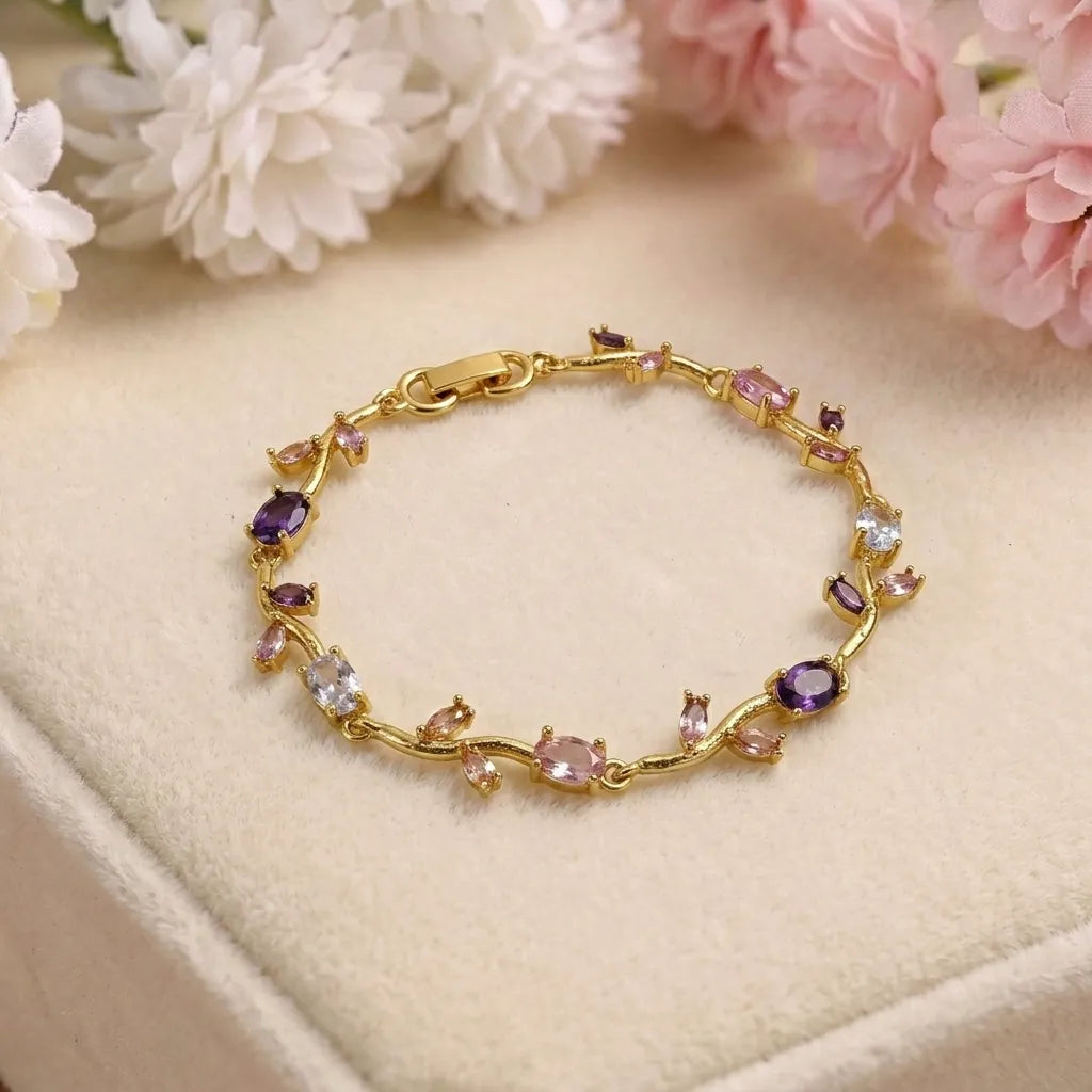 Marvel Silver gold-plated multicolor crystal vine bracelet featuring purple, pink, and white oval and marquise-cut stones with an elegant floral-inspired design for women and girls, ideal for weddings, parties, festive wear, daily styling, and gifting.