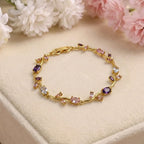Marvel Silver gold-plated multicolor crystal vine bracelet featuring purple, pink, and white oval and marquise-cut stones with an elegant floral-inspired design for women and girls, ideal for weddings, parties, festive wear, daily styling, and gifting.
