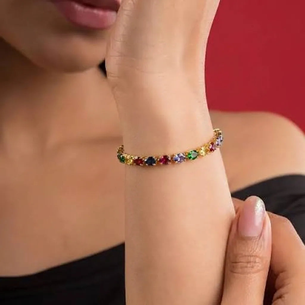 Marvel Silver gold-plated multicolor marquise crystal bracelet featuring colourful gemstone-inspired crystals in green, blue, red, purple, yellow, pink, and champagne shades, designed for women and girls, perfect for parties, weddings, festive occasions, daily wear, and gifting.