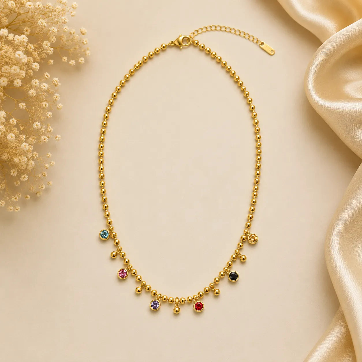 Marvel Silver gold-plated multicolor stone chain pendant for women and girls featuring colorful crystal charms, polished bead accents, and a delicate gold chain with a premium finish.