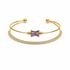Marvel Silver gold-plated open cuff kada featuring a purple baguette crystal bow centerpiece with sparkling Cubic Zirconia detailing, designed for women and girls, perfect for daily wear, weddings, parties, festive occasions, office wear, and gifting.