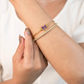 Marvel Silver gold-plated open cuff kada featuring a purple baguette crystal bow centerpiece with sparkling Cubic Zirconia detailing, designed for women and girls, perfect for daily wear, weddings, parties, festive occasions, office wear, and gifting.