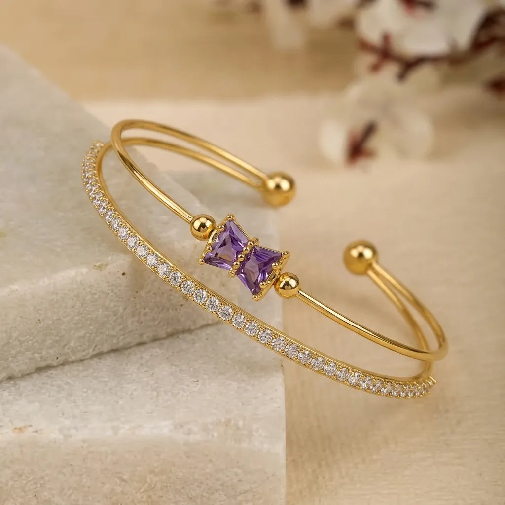 Marvel Silver gold-plated open cuff kada featuring a purple baguette crystal bow centerpiece with sparkling Cubic Zirconia detailing, designed for women and girls, perfect for daily wear, weddings, parties, festive occasions, office wear, and gifting.
