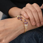 Marvel Silver gold-plated open cuff kada featuring purple marquise-cut crystal leaf motifs and sparkling Cubic Zirconia floral accents, designed for women and girls, perfect for weddings, parties, festive occasions, office wear, daily wear, and gifting.