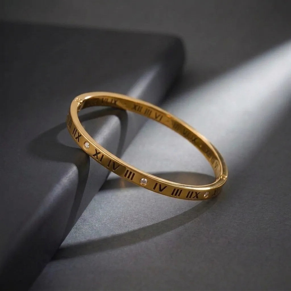 Marvel Silver gold-plated Roman numeral engraved kada bracelet featuring sparkling Cubic Zirconia stone accents with a secure hinged lock, designed for women and girls, perfect for daily wear, office, parties, weddings, festive occasions, and gifting.