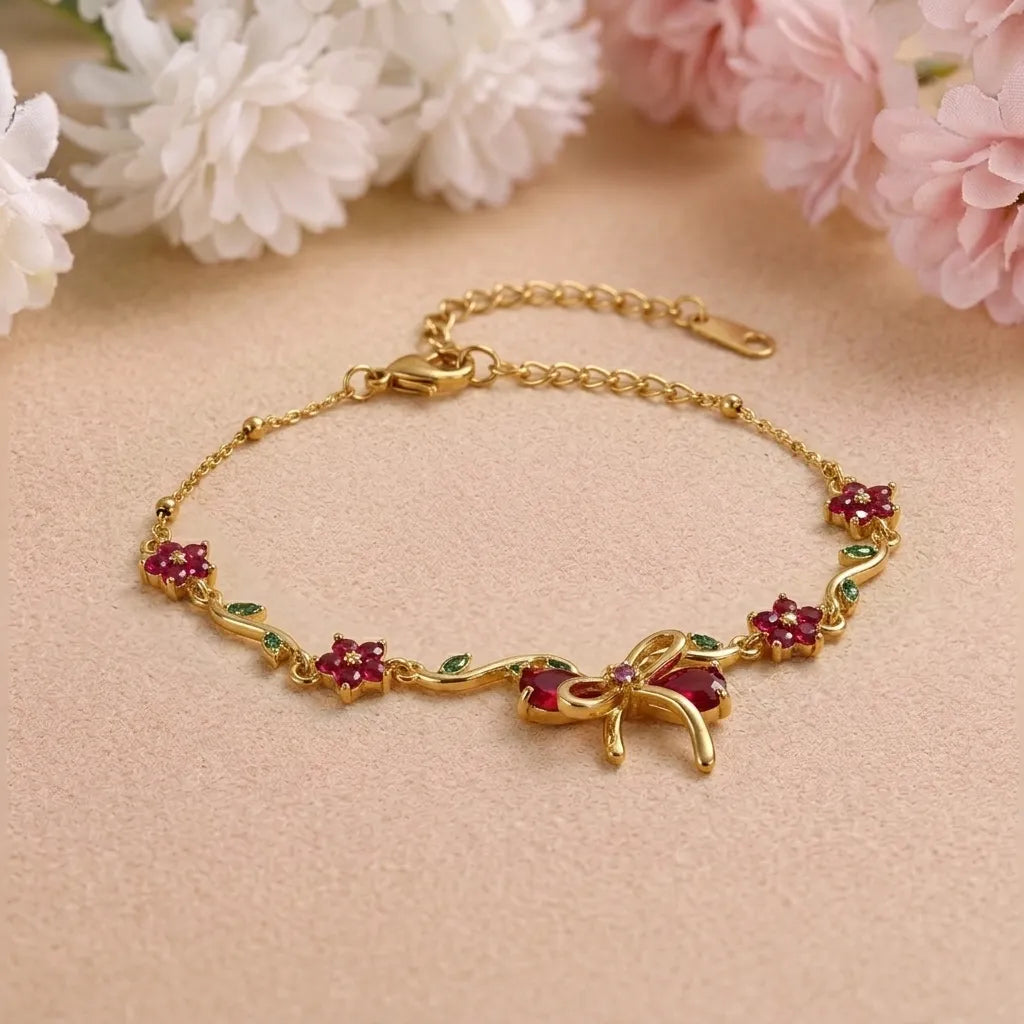 Marvel Silver gold-plated bracelet featuring a ruby-red butterfly centerpiece, floral stone charms, green leaf accents, and an adjustable extension chain for women and girls, ideal for daily wear, parties, weddings, festive occasions, and gifting.