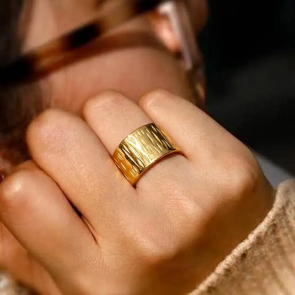 Marvel Silver gold-plated textured adjustable wide band ring for women and girls featuring an engraved pattern with a premium polished finish and open adjustable design.