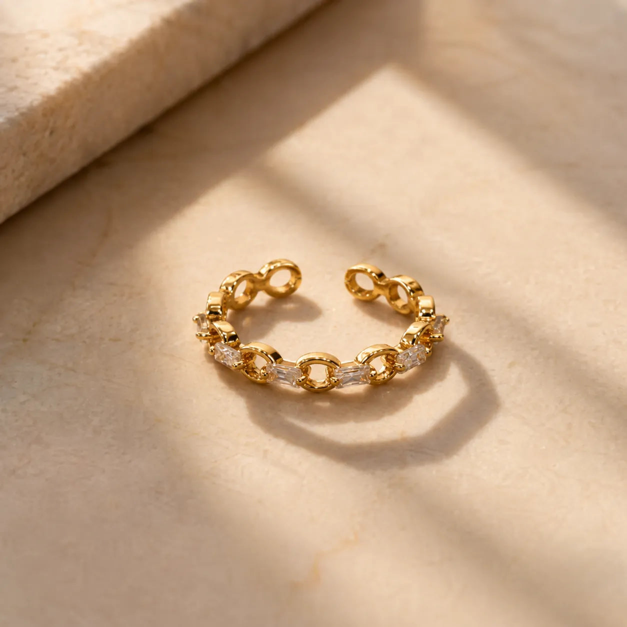 Marvel Silver gold plated adjustable chain link crystal ring for girls with baguette-cut stones and modern open design.