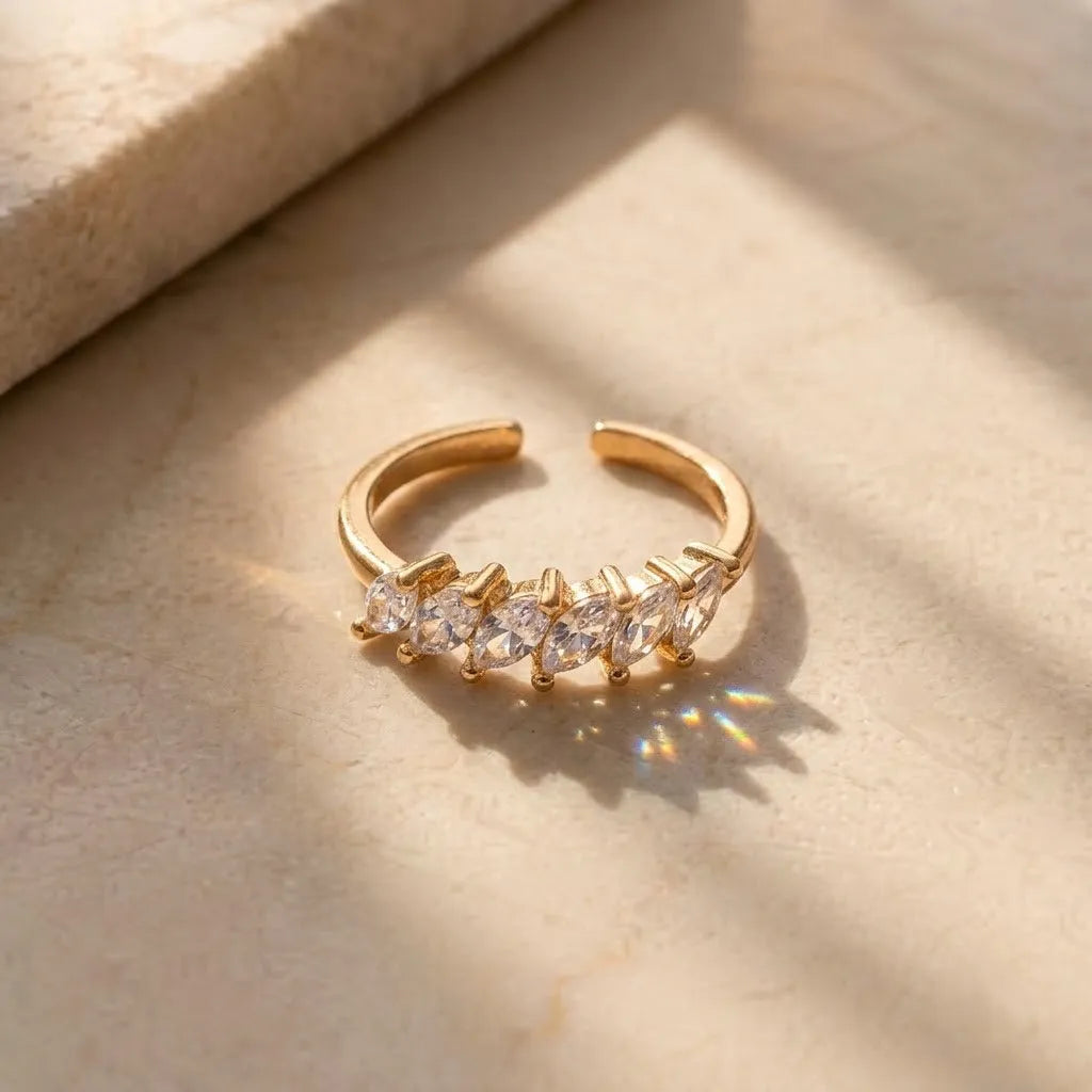 Marvel Silver gold plated adjustable marquise CZ imitation ring with sparkling crystal stones and heart-shaped open ends for women and girls.